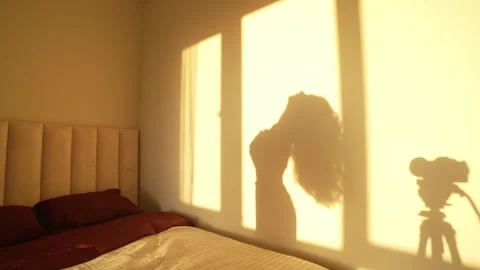 Sexy webcam model record her dance camera. Sunset woman silhouette. Girl shadow. Stock Footage 254463717