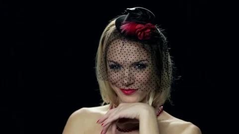Sexy widow posing, flirting on black background. Stock Footage 82636094