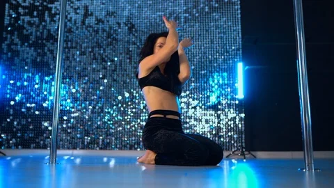 Sexy woman dancing on floor near pylone.... | Stock Video | Pond5
