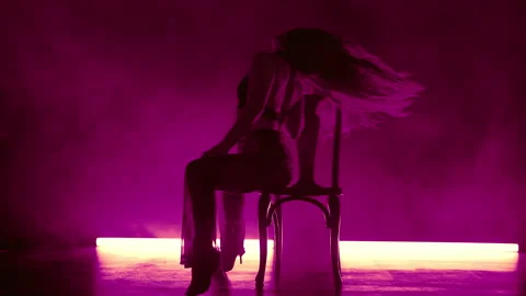 Sexy Woman Dancing While Sitting On Chair On Stage With Neon Light. Seductive Stock Footage 288710354