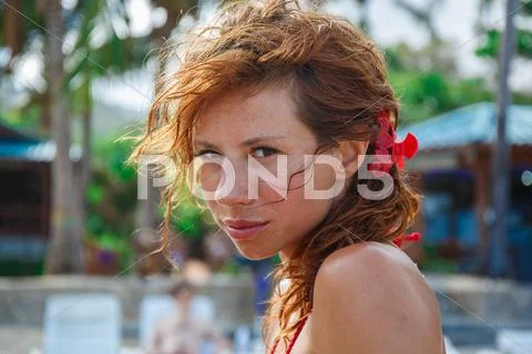 Sexy woman with flower in hair Stock Photos