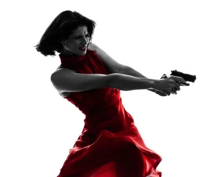 Sexy woman holding gun  silhouette Stock Photos