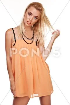 Sexy woman in short chiffon dress Stock Photos