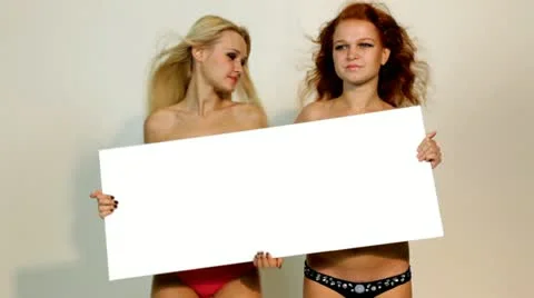 Sexy womans holding empty white board Stockbeeldmateriaal 11516354