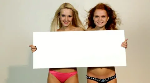 Sexy womans holding empty white board 库存影片 11516374