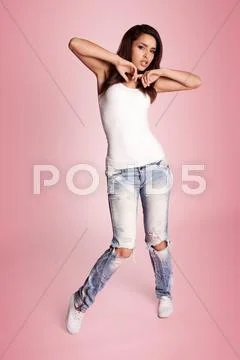 Sexy young hip hop dancer posing standing sideways to the camera before start Stock Photos