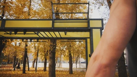 Sexy young man doing pull-ups Stock Footage 96771526