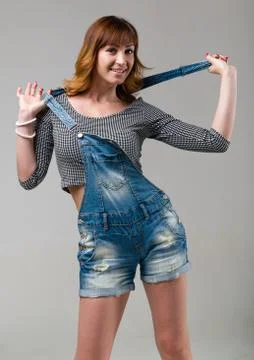 Sexy young woman isolated on gray Stock Photos