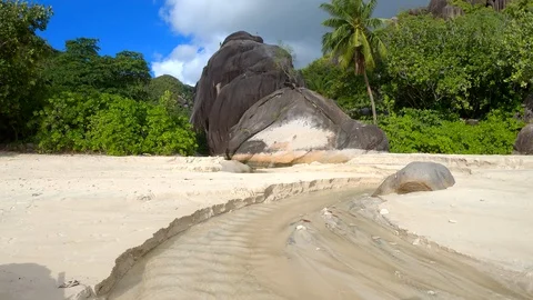 Seychelles beach stream Stock Footage 129408250