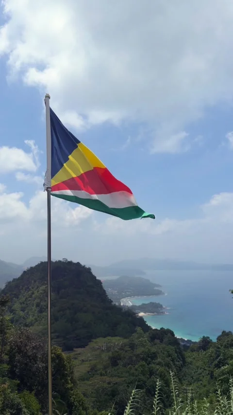 Seychelles flag over the breath taking view from the tea factory, strong wind 스톡 동영상 331066943