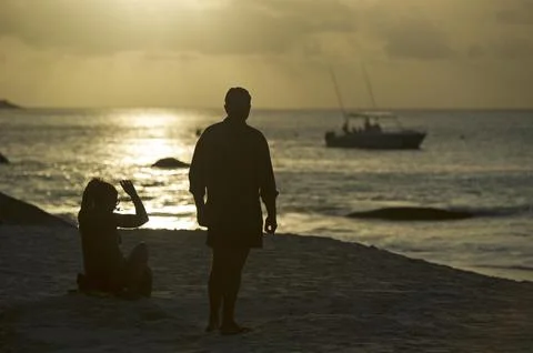 Seychelles-shark Attack On British Man Ian Redmond. A Sunset Vigil By Locals And Stock Photos