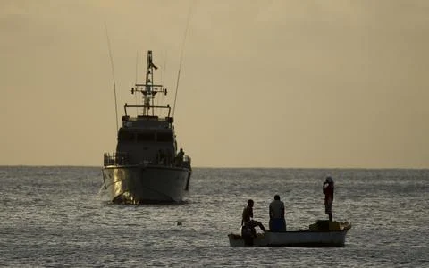 Seychelles-shark Attack On British Man Ian Redmond. A Sunset Vigil By Locals And Stock Photos