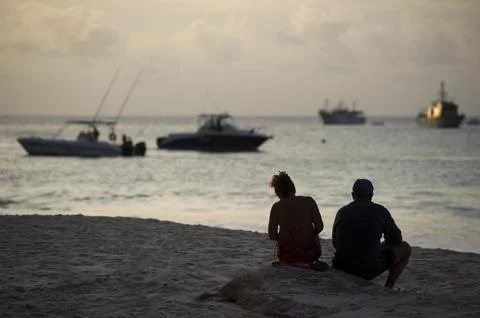 Seychelles-shark Attack On British Man Ian Redmond. A Sunset Vigil By Locals And Stock Photos