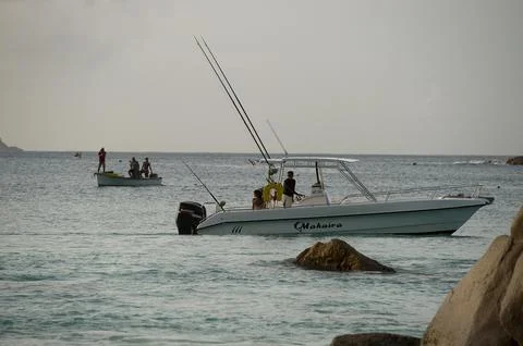 Seychelles-shark Attack On British Man Ian Redmond. A Sunset Vigil By Locals And Stock Photos