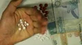 Seychellois Rupee SCR, Counting Drugs and Money, Health Care, Colorful Pills HD Footage