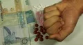 Seychellois Rupee SCR, Counting Drugs and Money, Health Care, Colorful Pills HD Footage
