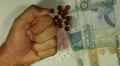 Seychellois Rupee SCR, Counting Drugs and Money, Health Care, Colorful Pills HD Footage