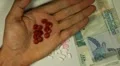 Seychellois Rupee SCR, Counting Drugs and Money, Health Care, Colorful Pills HD Footage
