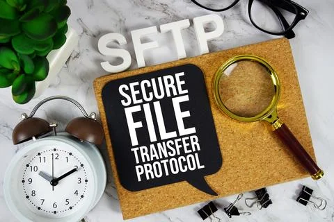 SFTP - Secure File Transfer Protocol acronym with alarm clock and magnifyin.. Stock Photos