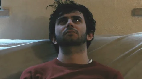 Shabby Boy on Sofa Close-up Video stock 87204229