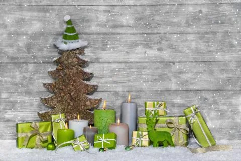 Shabby chic green and white christmas decoration on grey wooden background wi Stock Photos