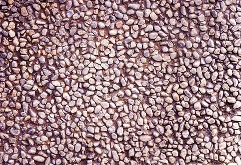 Shabby, worn-out background texture.Texture from small  shabby pebble. Mosa.. Stock Photos