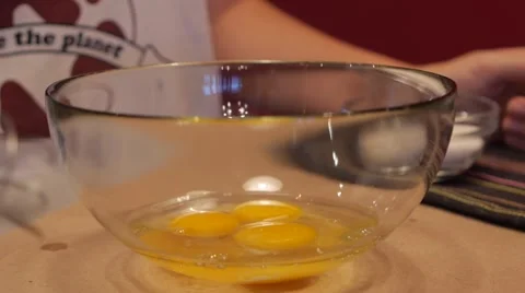 Shacking an eggs in a bowl with hand mixer slow motion Stock Footage 49078150