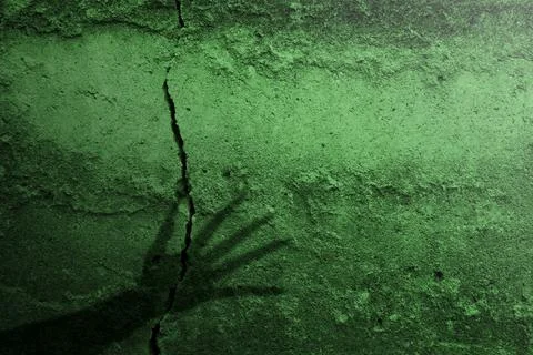 Shade of witch hands on dark background. The hand appearing to be devil, ev.. Stock Photos
