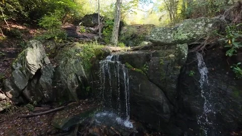 Shaded Rock Waterfall Spilling Into Pool, Ledge And Boulder Foreground, Fallen Stock Footage 331121126