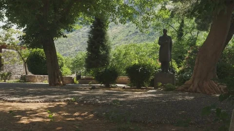 Shades Under Trees at Aleksa Santic Monument, Mostar, Bosnia, Establishing shot Stock Footage 233962948