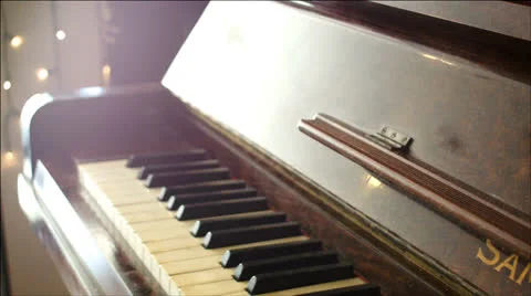 Shadow across the piano Stock Footage 22666546
