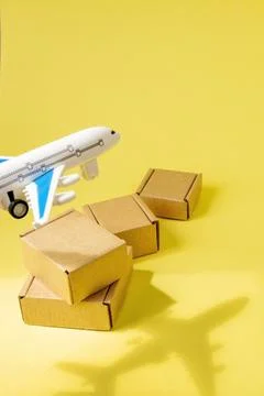 Shadow Airplane and stack of cardboard boxes. concept of air cargo and parcel Stockfoto's
