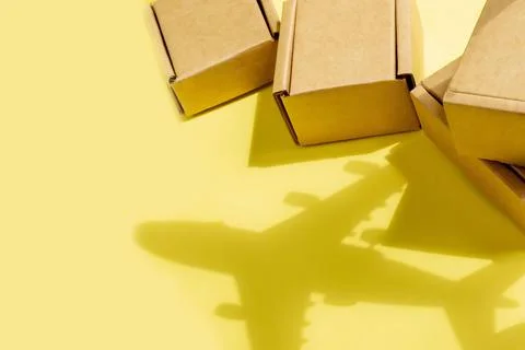 Shadow Airplane and stack of cardboard boxes. concept of air cargo and parcel 스톡 사진