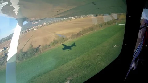 Shadow of airplane taking off seen from the window Video stock 331195230