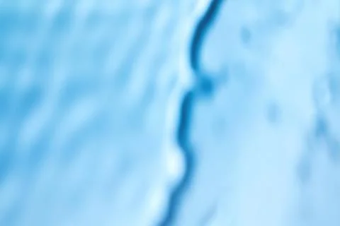 Shadow and light caustic effect on blue wall Illustrazione stock