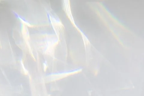 Shadow and light caustic effect on a white wall Stock Photos