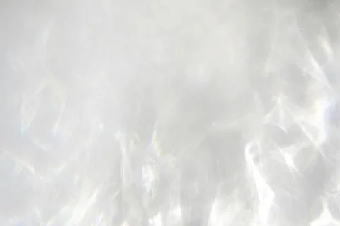 Shadow and light caustic effect on a white wall Stock Photos