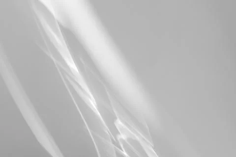 Shadow and light caustic effect on a white wall Stock Photos