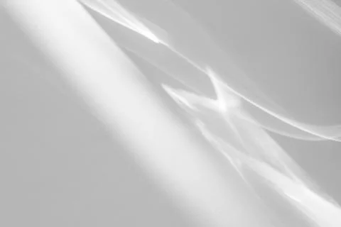 Shadow and light caustic effect on a white wall Stock Photos