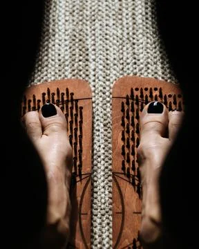 Shadow and light play over wooden acupressure boards with protruding pegs Stock Photos