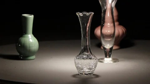 Shadow and lighting  on ceramics vase and glass. Video stock 99718123
