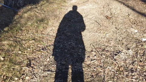 Shadow of anonymous man walking on nature. Stock-Footage 104136823