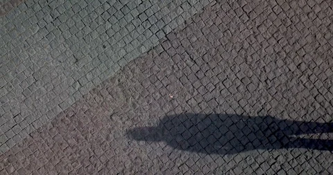 Shadow Of Anonymous Man Walking On the street early morning Stock Footage 108599801