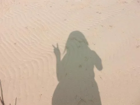 Shadow on the beach Stock Photos