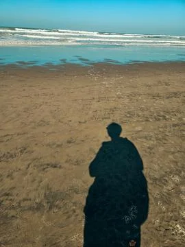 A shadow on the beach Stock Photos