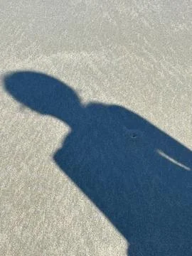 Shadow on the beach sand Stock Photos