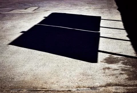 Shadow of billboards on the road Stock Photos