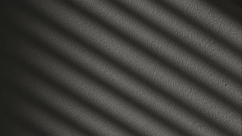 The shadow from the blinds on the white wall, time-lapse. Flickering. Stock Footage 214657729