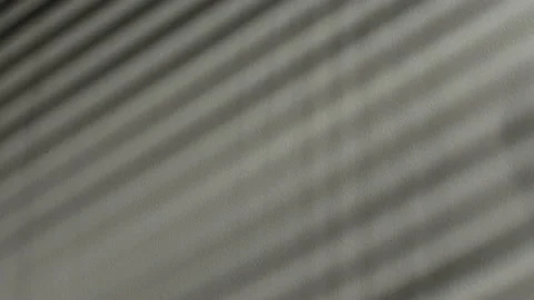 Shadow of blinds windows on the white wall in, time-lapse. Stock Footage 201342245