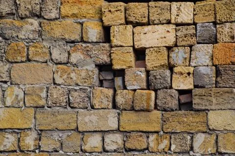 Shadow from the blocks of limestone shell. Wall texture background Stock Photos